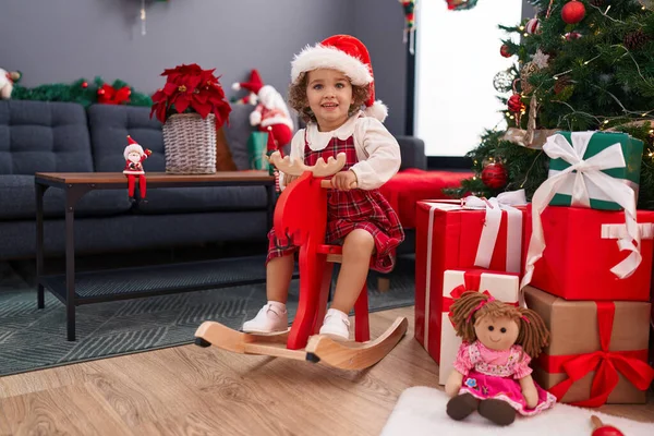 Adorable Hispanic Toddler Playing Reindeer Rocking Christmas Tree Home — Stock Photo, Image