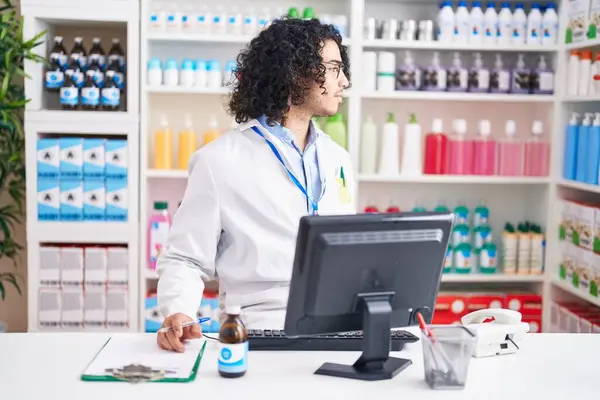 Hispanic Man Curly Hair Working Pharmacy Drugstore Looking Side Relax — Stock Photo, Image