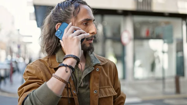 Young Hispanic Man Talking Smartphone Serious Expression Street —  Fotos de Stock