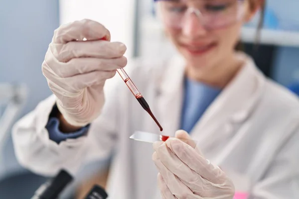 Young Blonde Woman Scientist Pouring Blood Sample Laboratory — Stock Photo, Image