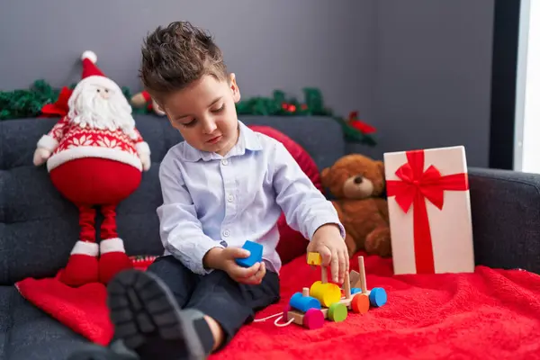 Adorable Hispanic Toddler Playing Train Toy Sitting Sofa Christmas Decoration — Stock Photo, Image