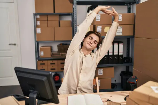 Young Caucasian Man Ecommerce Business Worker Stretching Arms Office — Stockfoto