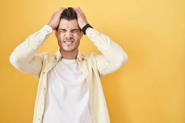 Young Hispanic Man Standing Yellow Background Suffering Headache Desperate Stressed — Stock fotografie