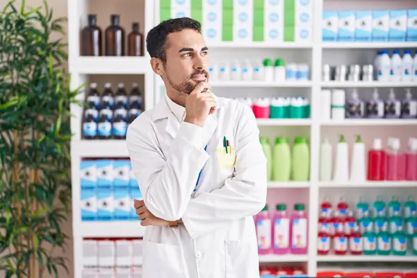 Handsome Hispanic Man Working Pharmacy Drugstore Looking Confident Camera Smiling — Stock Photo, Image