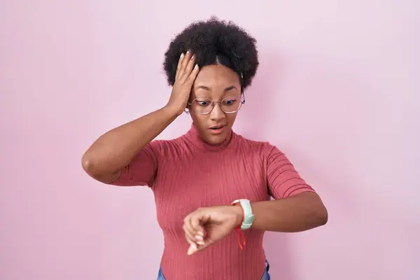 Beautiful African Woman Curly Hair Standing Pink Background Looking Watch — Stock Photo, Image