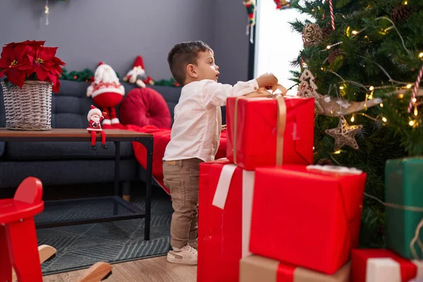 Adorable Hispanic Boy Decorating Christmas Tree Home — Stock Photo, Image