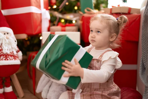 Adorable Caucasian Girl Holding Gift Sitting Floor Christmas Tree Home — Stock Photo, Image