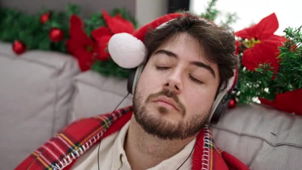 Young Hispanic Man Celebrating Christmas Sleeping Sofa Home — Stock Video