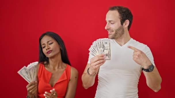 Beautiful Couple Smiling Confident Holding Dollars Isolated Red Background — Stock Video