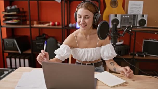 Young Woman Radio Reporter Opening Laptop Wearing Headphones Speaking Radio — Stock Video