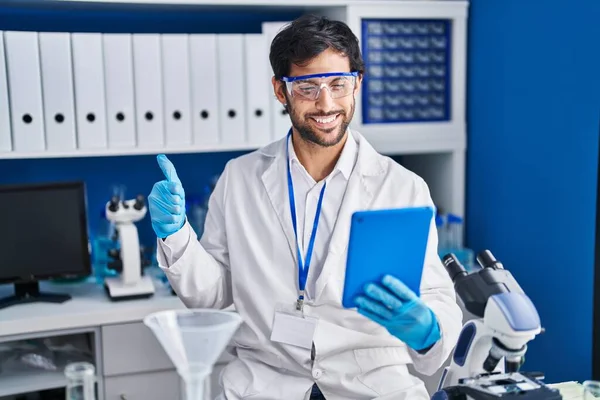 Handsome Latin Man Working Scientist Laboratory Using Tablet Smiling Happy — Stock Photo, Image