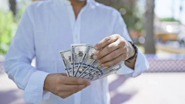 Handsome Young Hispanic Grey Haired Man Counting Bundle Cash Outdoors — Stock Photo, Image