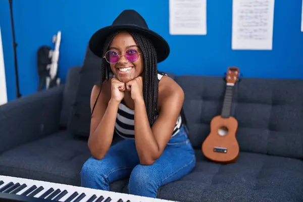 African American Woman Musician Smiling Confident Sitting Sofa Music Studio — Stockfoto