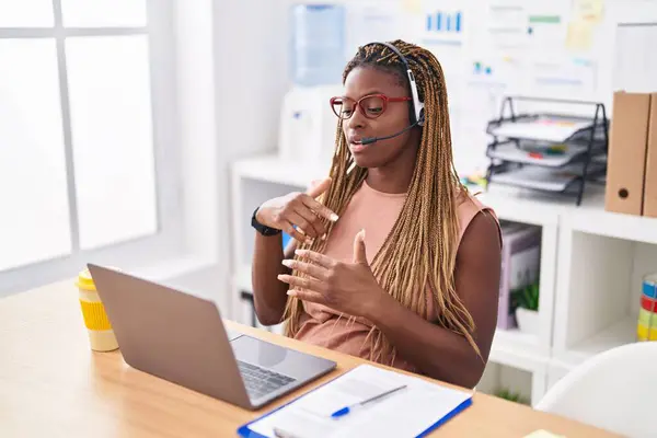 African american woman call center agent having video call vertical video at office