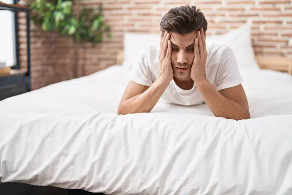 Young Hispanic Man Stressed Lying Bed Bedroom —  Fotos de Stock