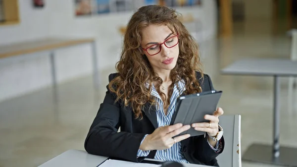 Young woman business worker using touchpad at the office
