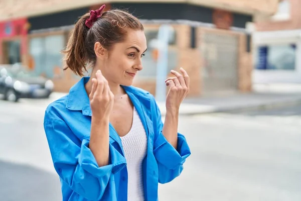 Young Woman Smiling Confident Doing Spend Money Gesture Street — Stockfoto