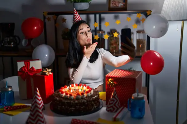 Young caucasian woman celebrating birthday having video call at home