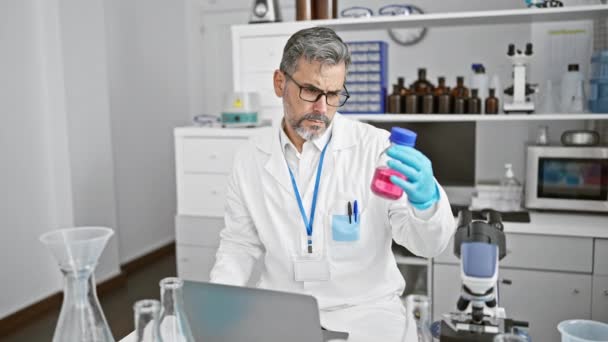 Young Hispanic Grey Haired Man Scientist Holding Test Tube Using — Stock Video