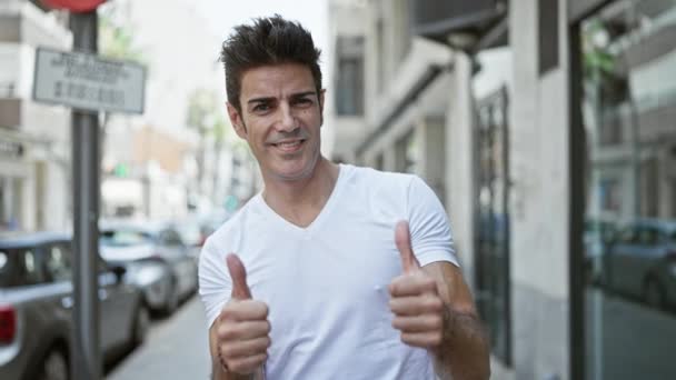 Young Hispanic Man Smiling Confident Doing Sign Thumbs Street — Wideo stockowe