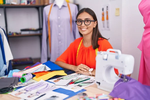 Young Beautiful Hispanic Woman Tailor Smiling Confident Sitting Table Tailor — Stock Photo, Image