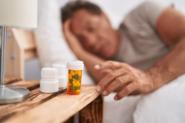 Middle Age Man Lying Bed Holding Pills Bottle Bedroom — Stock Photo, Image