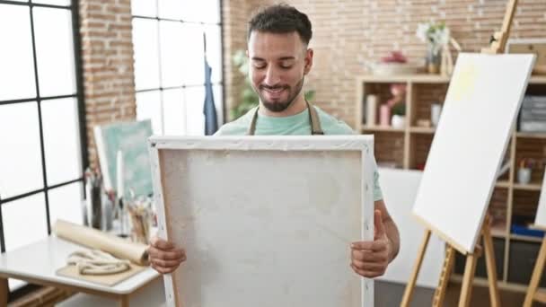 Young Arab Man Artist Smiling Confident Holding Draw Art Studio — Stock Video