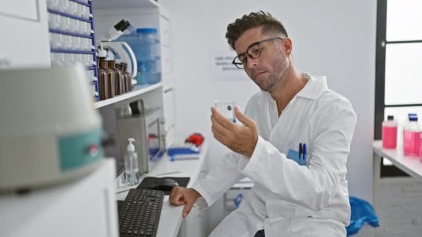 Attractive Young Hispanic Man Working Tirelessly Lab Engrossed Scientist Holding — Stock Video