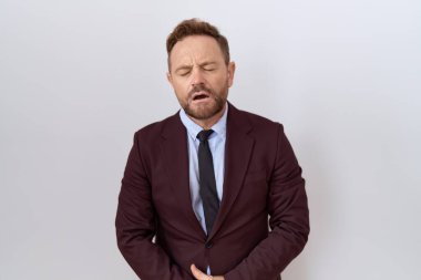 Orta yaşlı, sakallı, eli karnında kravat takan bir iş adamı. Çünkü hazımsızlık, acı verici bir hastalık, kendini iyi hissetmiyor. Ağrı kavramı. 