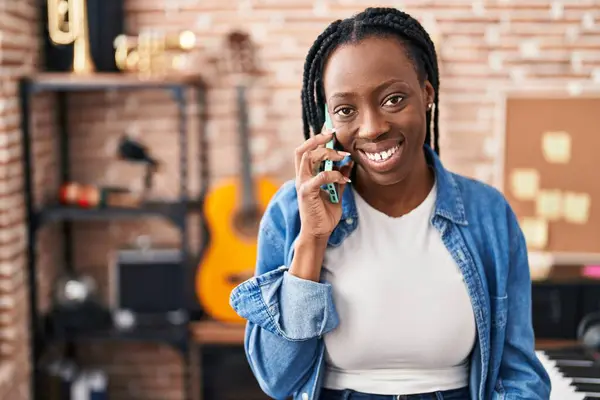 African American Woman Artist Smiling Confident Talking Smartphone Music Studio — Fotografia de Stock