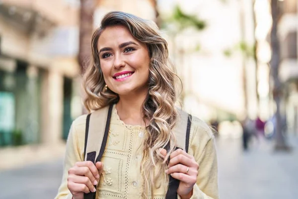 Young woman tourist smiling confident walking at street