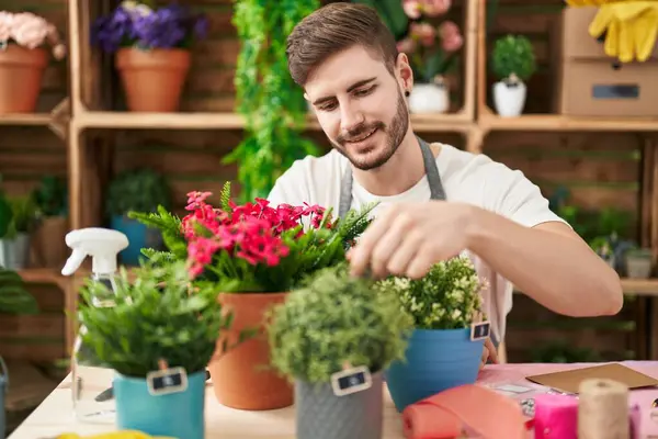 Young Caucasian Man Florist Smiling Confident Touching Plant Flower Shop — Φωτογραφία Αρχείου