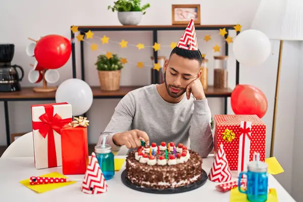 African american man celebrating birthday with serious expression at street