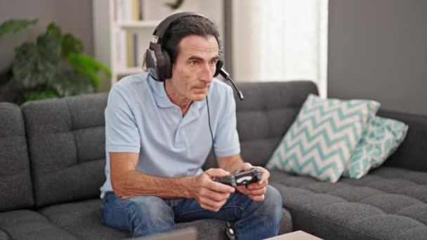Middle Age Man Playing Video Game Sitting Sofa Looking Upset — Stock Video