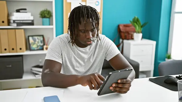 African american man business worker using touchpad at the office