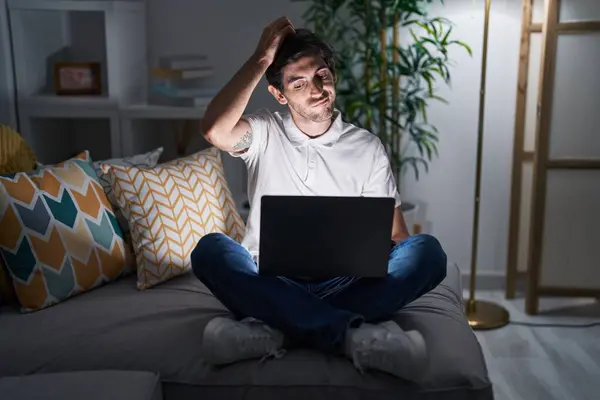 Young Hispanic Man Using Laptop Home Night Confuse Wondering Question — Stock Photo, Image