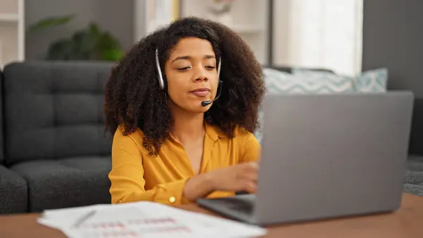 African american woman call center agent having video call working at home