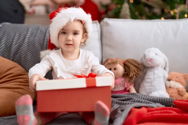 Adorable Caucasian Girl Holding Gift Sitting Sofa Christmas Tree Home — Stock Photo, Image