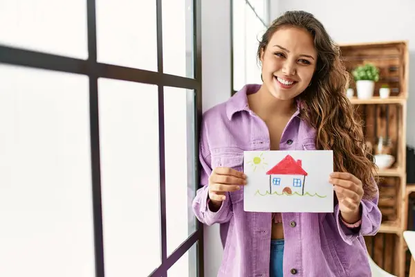 Young Beautiful Hispanic Woman Smiling Confident Holding House Draw Home — Stockfoto