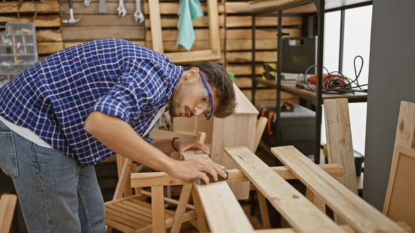 Handsome Serious Young Arab Man Working Diligently Sanding Wood Plank — Stock Photo, Image