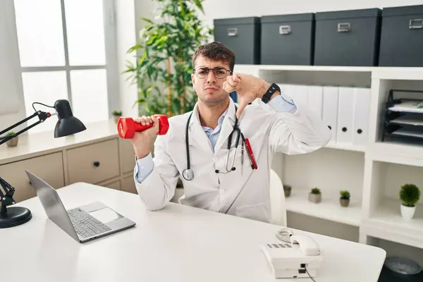 Young Hispanic Doctor Man Holding Dumbbells Angry Face Negative Sign — Stock Photo, Image