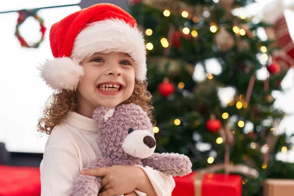 Adorable Blonde Girl Hugging Teddy Bear Standing Christmas Tree Home — Stock Photo, Image
