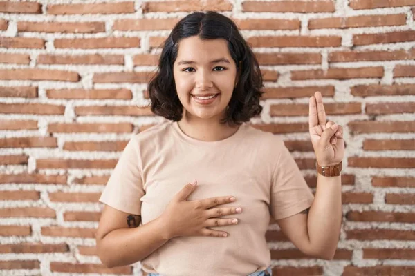Young Hispanic Woman Standing Bricks Wall Smiling Swearing Hand Chest — Stock Photo, Image