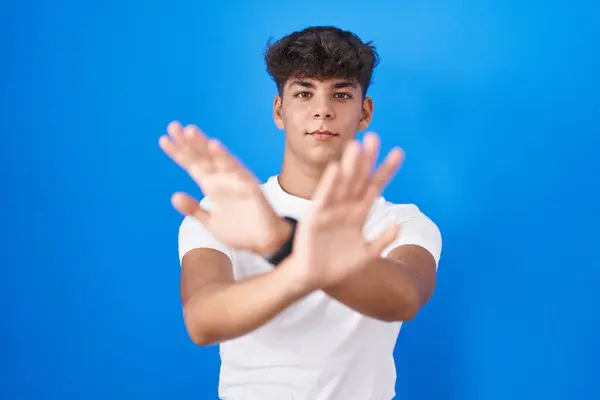 Hispanic Teenager Standing Blue Background Rejection Expression Crossing Arms Palms — Stock Photo, Image