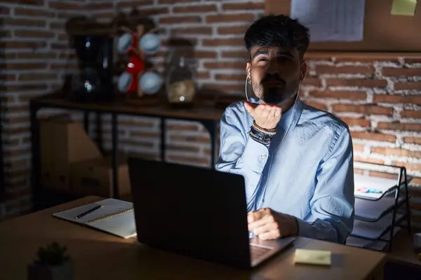 Young Hispanic Man Beard Working Office Night Looking Camera Blowing — Stock Photo, Image