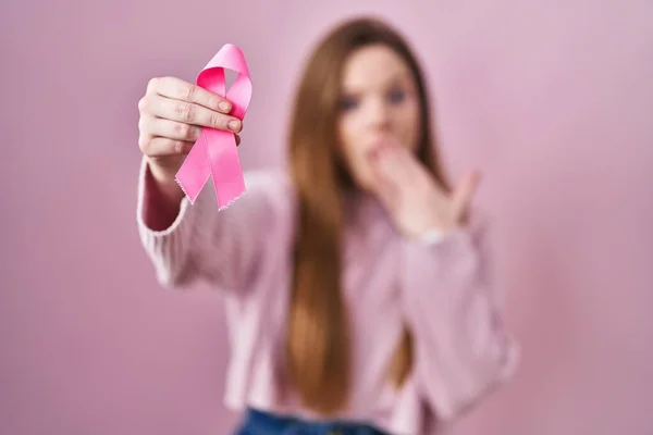 Young Caucasian Woman Holding Pink Cancer Ribbon Covering Mouth Hand — Stock Photo, Image