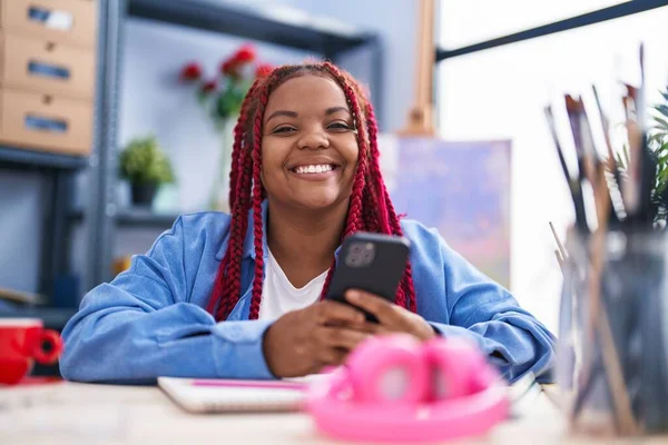 African American Woman Artist Smiling Confident Using Smartphone Art Studio —  Fotos de Stock