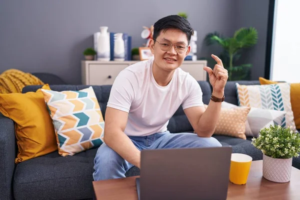Young Asian Man Using Laptop Home Sitting Sofa Smiling Confident — Stock Photo, Image