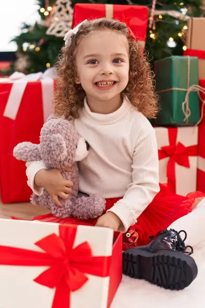 Adorable Blonde Girl Unpacking Teddy Bear Gift Sitting Floor Christmas — Stock Photo, Image