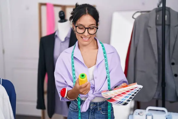 Young Beautiful Hispanic Woman Tailor Smiling Confident Holding Thread Color — Stockfoto